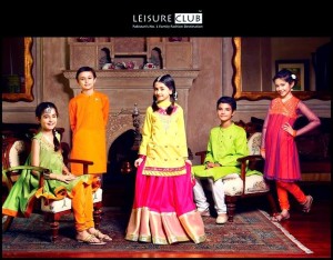 Kids of these days are quite touchy about their looks. So for all such kids we are sharing Kids Eid Dresses 2014. There are many brands working on kids dresses these days and one the most prominent brand among them is Leisure Club. They are working since 1997 and are producing both Western and Eastern dresses for boys and girls. Recently Leisure Club Latest Eid Collection 2014 has been launched which include some of the most stunning Eastern dresses of boys and girls. Lets have a look at the collection of we are sharing. Leisure Club Kids Eid Dress Collection 2014: Eid is one of the great religious occasions in Pakistan and for this special event Leisure club has unveiled their beautiful eid collection which consists of dresses of eastern kind for both teenage and young boys and girls. GIRLS COLLECTION: To be fashionable is a female’s right so, girls are seemed to be more concern about their looks on every special occasion. Leisure club eid dresses for girls have all those characteristics that a young girl may want in her dresses.  The stuff they used for dresses is of different types like jamawar, chiffon and raw silk. The color combination they have used is the thing that makes their dresses a master piece. The collection include long shirts, frocks, shararas, open shirts and angrakha style dresses. They are beautifully adorned with embroidery, fancy laces and different ribbons.  BOYS COLLECTION: Now days boys do not remain behind from girls in fashion and trends. Their fashions are also changing and they want to keep their looks up to date. The kurta is the dress that boys love to wear on Eid occasion and keeping this thing in mind the brand has launched beautiful kurta designs for boys on this event. The kurtas are paired with pajamas that give a traditional look. The colors used are refreshing due to summer season like red, white, fresh green and blue. They are made formal with embroidery on the neckline and sleeves are both straight and with cuffs. 